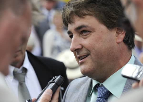 Robert Cowell, trainer of Intrinsic, reacts to his runner's win in the 2014 Stewards' Cup / Picture by Malcolm Wells