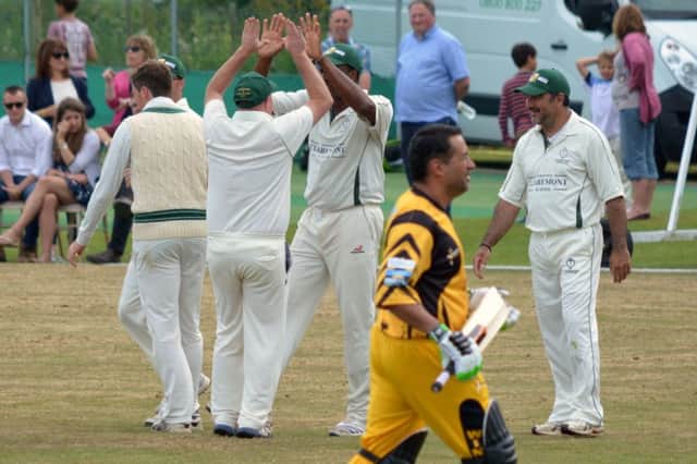 Crowhurst Park celebrate the fall of a Lashings All-Stars wicket. Picture by Stephen Curtis (SUS-150629-184059002)