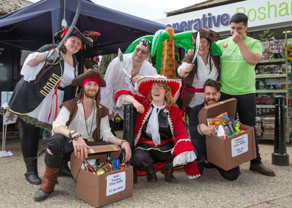 It's a pirates life for these, top from left Kay Bailey, Nigel Kyte, Glynis Shepherd and Matt Harwood, bottom from left, Benji Shergold, Fiona Greenleves and Andy Harwood