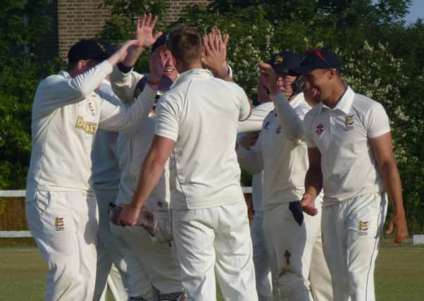 Hastings Priory celebrate after taking the final wicket in their victory at home to Findon last weekend. Picture by Simon Newstead (SUS-150627-212450002)