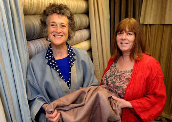 Linen shop has had some of its fabric selected to be used on the set of the new Mr Holmes film, starring Ian Mckellen. Fran White (left) is wearing a kimono made from some of the fabric used, with her colleague Trudi Robb. Pic Steve Robards SR1516459 SUS-150715-094340001
