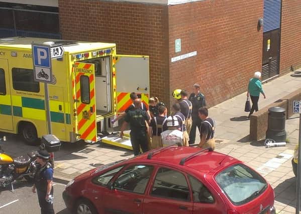 The emergency services work together to remove an injured person from the High Street multi-storey car park