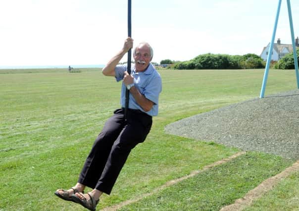 Councillor Mike Beal, chairman of Selsey Town Council, has a go on the zip wire at the newly refurbished playground PICTURE BY KATE SHEMILT ks1500250-2