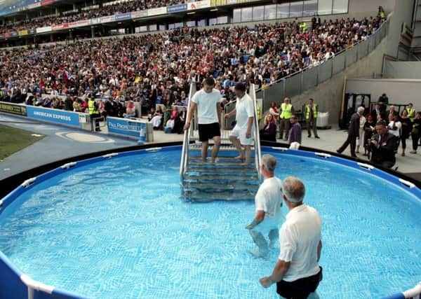The first-ever Jehovahs Witnesses baptism at the Amex Stadium in 2012