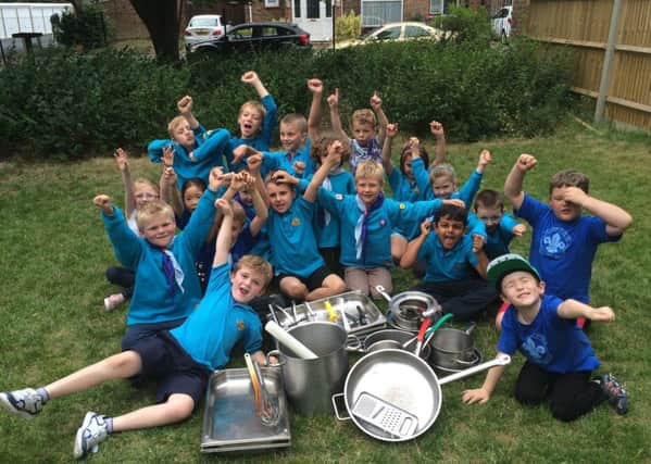 1st Langley Green Beavers with a pile of their new pots and pans donated by UK Power Networks - picture submitted by UK Power Networks