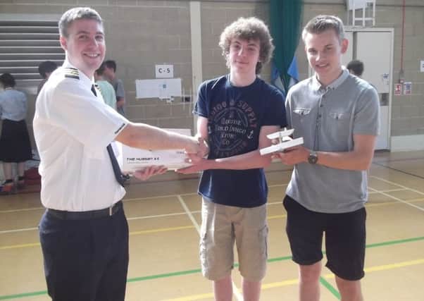 Pilot Alex McMillan presents first prize to Ben Fidling and  Connagh Launchbury. SUS-150907-125559001