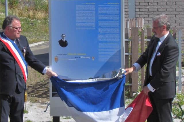 Councillor Vic Walker unveils the commemorative information board with the Mayor of Richebourg