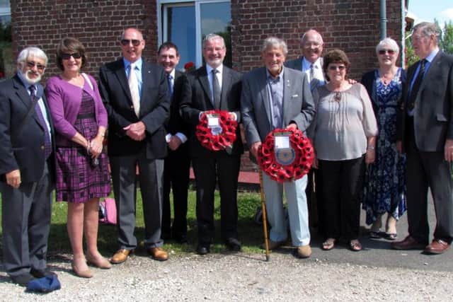 Councillor Vic Walker (centre holding the wreath) with members of Worthing Rotarians who travelled to Richebourg to participate in the service
