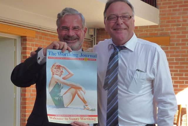 Councillor Vic Walker and the Mayor of Richebourg, Gérard Delahaye, display the poster of Sunny Worthing given by Paul Holden, editor of the Worthing Journal