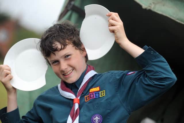 2nd Tangmere Scout Aidan Collins at the Greek plate smashing stall LA150057-8