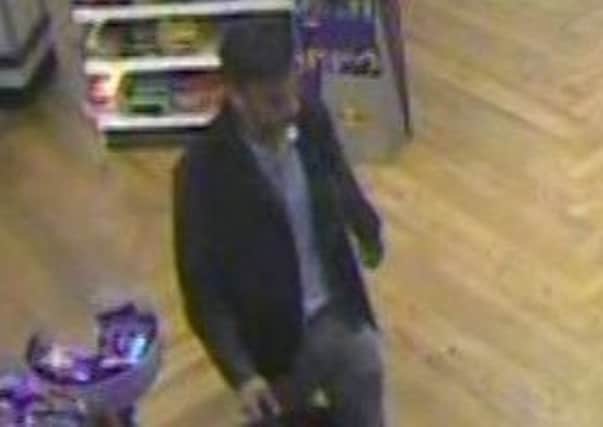 CCTV image of a man who bought champagne with a Horsham pensioner's credit card