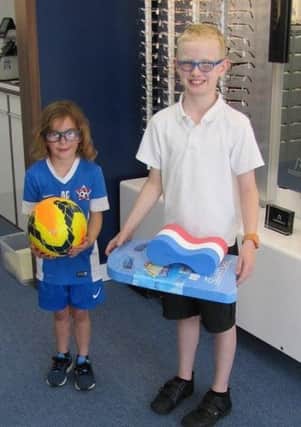 Aimee Chiddle and Austin Wilton, winners of a sporting competition run by Bridle Opticians