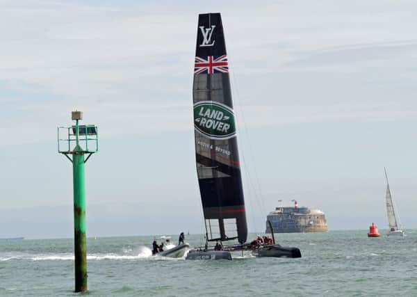 Boats taking part in the America's Cup enter Portsmouth Harbour for the first time where they were hoisted from the water at the events UK headquarters 
Picture Ian Hargreaves  (151185-7)