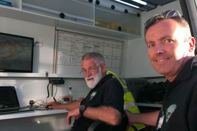 John Griffiths, the search manager in charge of the incident, with Peter Robinson, another search manage, in the van