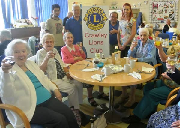 Crawley Lions team up with Age UK to service up a fish and chip lunch to the senior citizens - picture submitted