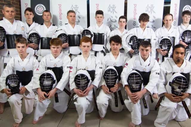 Kumite picture (Sparring Team) - holding helmets. Bottom Row, Left to right  James Porter, Jordan Littlecott, Simon Bosher (all from Burgess Hill), Chris Udell (Haywards Heath), Hal Foster (Ardingly), Ajit Dutta (Haywards Heath). Back Row, Left to right  Martin Hadden (Lindfield), Eddie Entwisle (Ardingly), Marc DonFrancesco (Chelwood Gate), George Howard-May (Haywards Heath), Ollie Lainchbury (Ditchling), Evan Diamond (Ditchling), Geoff Neumann (Stirling, Scotland), Tom French (Haywards Heath), Joe Mellor (Hassocks). Picture Ajit Dutta  Raid Studios
