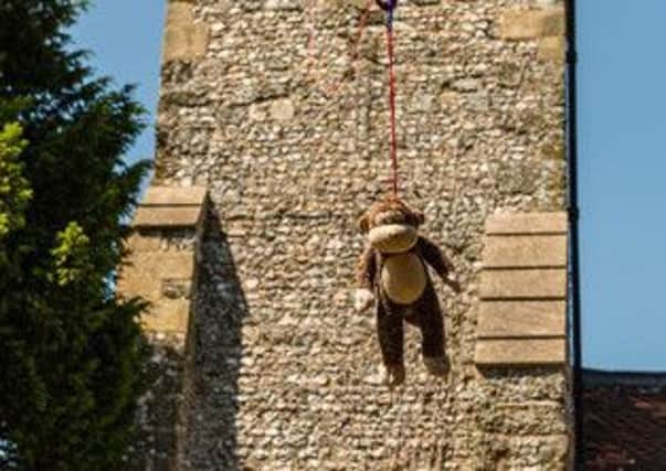 The fun fundraising event saw teddy bears and friends abseil down the church tower