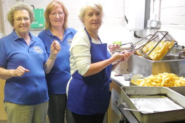 Crawley Lions team up with Age UK to service up a fish and chip lunch to the senior citizens - picture submitted