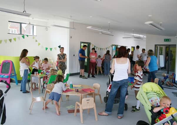 Families look around Walberton Community Playcentre for the first time