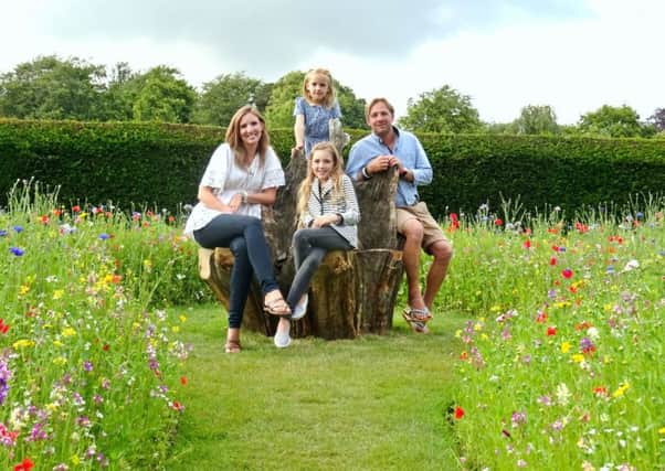 The Mumby family enjoying the gardens at Arundel Castle SUS-150722-094234001