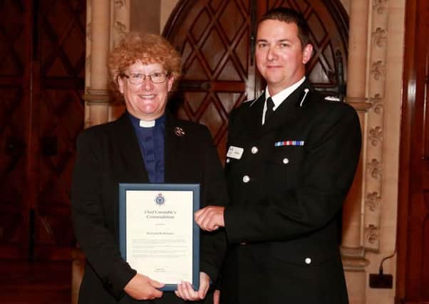 Rev Kath Jones recieving the Chief Constable's Commendation Award from Assistant Chief Constable Steve Barry SUS-150721-175806001