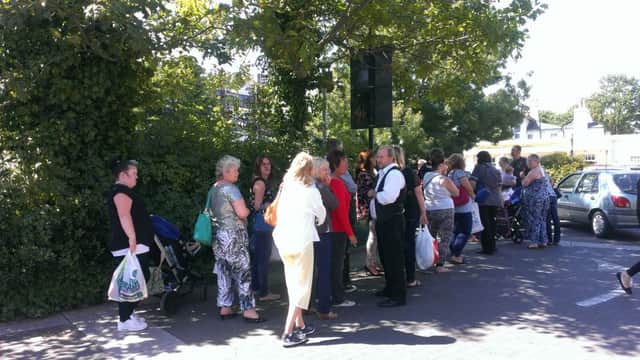 Residents queue to try and get out of the Liverpool Road car park in Worthing SUS-150722-152939001