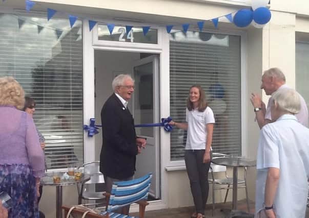 Katie Cleeves, Ken Scutt, and Felpham residents celebrate the opening of Felpham Physio