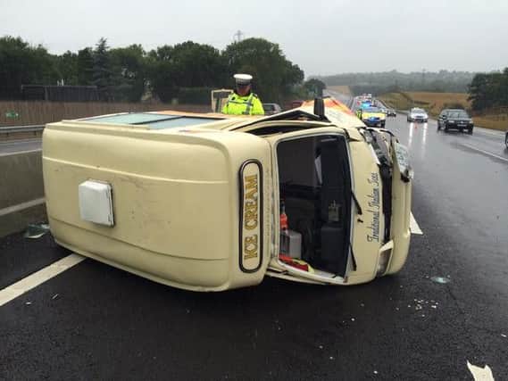 An ice-cream truck has overturned on the A23 SUS-150726-122231001