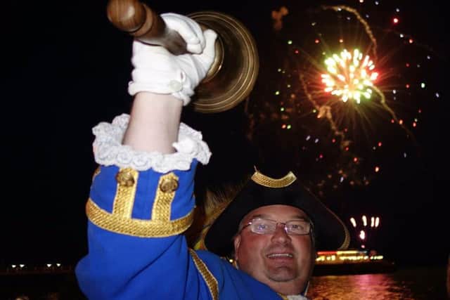 Worthing town crier Bob Smytherman rings in the fireworks on Saturday night