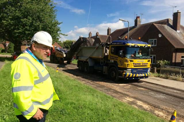 John O'Brien observing the Better Roads programme in action at St Nicholas Road, Lavant; (photo submitted). SUS-150728-111521001