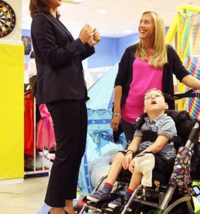DM1519959a.jpg Samantha Cameron launches new Hop, Skip and Jump Foundation Centre for disabled children in Swan Walk shopping centre, Horsham. Meeting Laura Moore and son William 6. Photo by Derek Martin SUS-150728-155243008