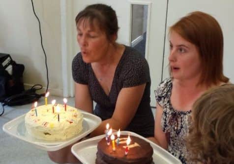 Manger Liz Johnson, left, and deputy manager Claire Kenyon blow out the birthday candles