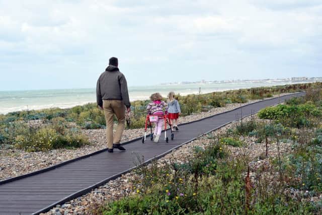 The boardwalk has recently been extended to The Burrells. Pictured are Cllr Ben Stride with his daughters, L-R Darcey Stride (6) and Neely Stride(3)  
Picture: Liz Pearce