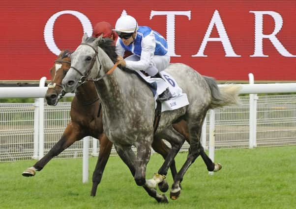 Solow flies towards the finish in the Qatar Sussex Stakes