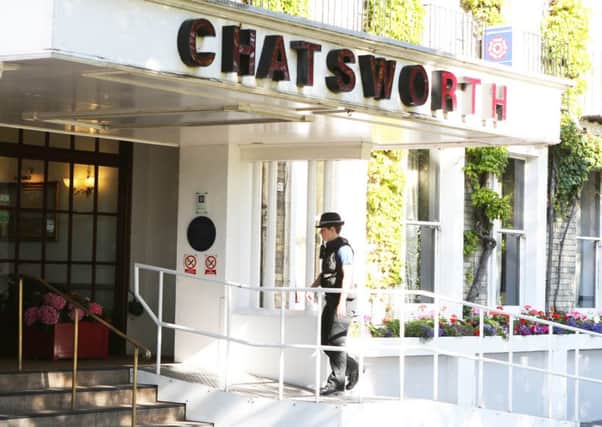 A policewoman at the Chatsworth hotel yesterday morning PHOTO: Eddie Mitchell SUS-150730-134644001