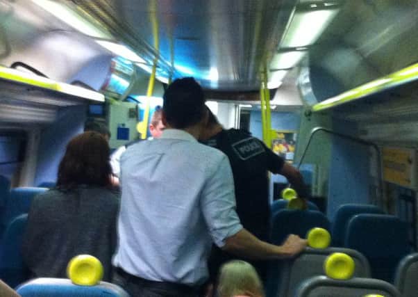 Police arrest a woman on a late night train to Chichester