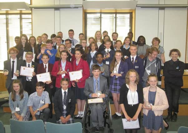 Youngsters across West Sussex receive their Democracy Awards for encouraging participation in the county's Youth Parliament and Youth Cabinet elections (photo submitted). SUS-150308-151849001