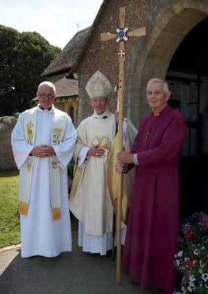 The Rev Gary Ingram, left, with the Bishop of Chichesterand cross bearer Christopher Hansen