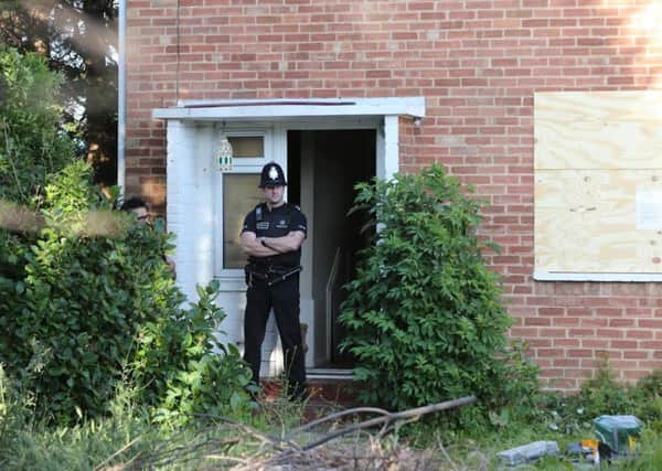 A police officer stands guard at 31, Ash Grove, Bognor Regis, on June 5. Picture by Eddie Mitchell SUS-150806-112142001