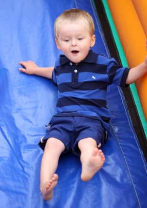 Three-year-old Harrison Wood on the slide DM151813a