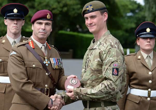 Pte Alexander Little collects the 5 Troop Best Shot Shield, from DCLF (Reserves) Major General Ranald Munro.