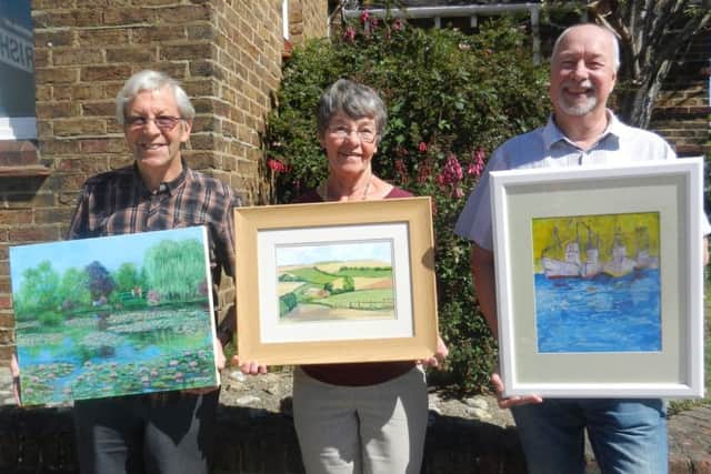John Stenning, last year's prize winner, assistant exhibition secretary Eve Wilson and Mark Juby