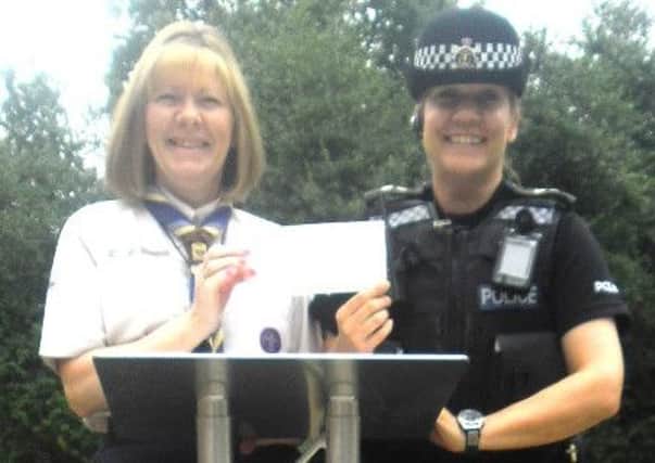 PC Natalie Stoner and county commissioner Irene Orford with the newly purchased lectern.
