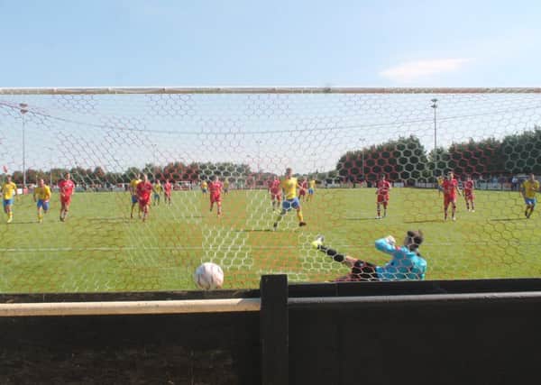 Joe Keehan calmly slots home the penalty at Needham Market. Picture by Colin Bowman