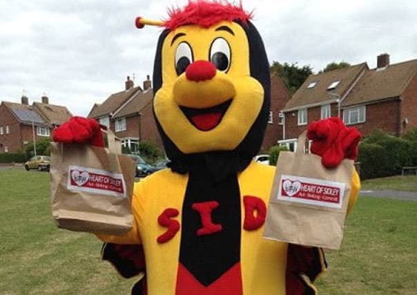 Sid the Heart of Sidley mascot.