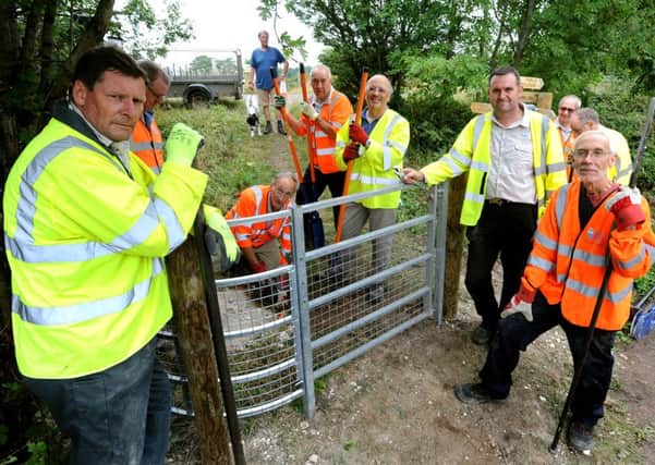Volunteers have banded together to install a kissing gate and fencing on the main road next to Bramber. Pic Steve Robards. SR1518375 SUS-151108-150531001