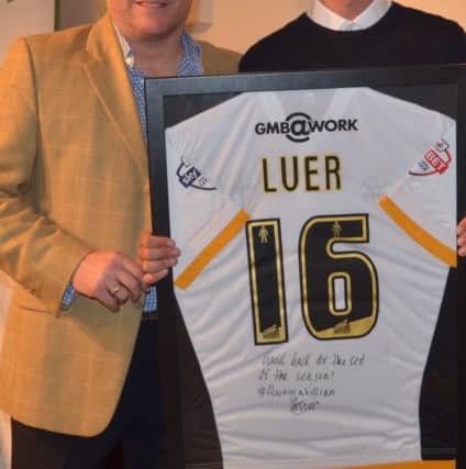 Greg Luer, with the Hull shirt he presented to the club, with manager Ian Chapman SUS-150527-085542001
