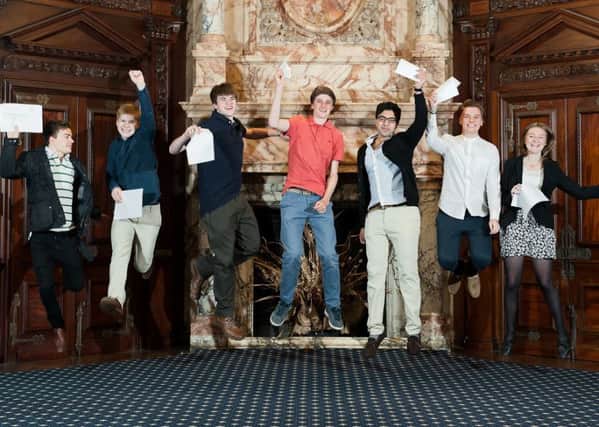 A-level students from Worth School in West Sussex celebrate their exam success in August 2014. Photo: Emma Duggan Photography