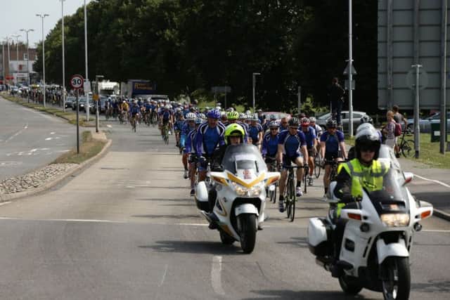 Procession of cyclists, including members of the Worthing Excelsior Cycling Club, accompany the coffin of great-grandfather Don Lock ahead of his funeral at Worthing Crematorium. PRESS ASSOCIATION Photo. Issue date: Wednesday August 12, 2015. Lock, a keen cyclist, was stabbed to death in an alleged road rage attack following a collision involving his car and another vehicle on the A24 at Findon, near Worthing, West Sussex, on July 16. See PA story FUNERAL Lock. Photo credit should read: Yui Mok/PA Wire