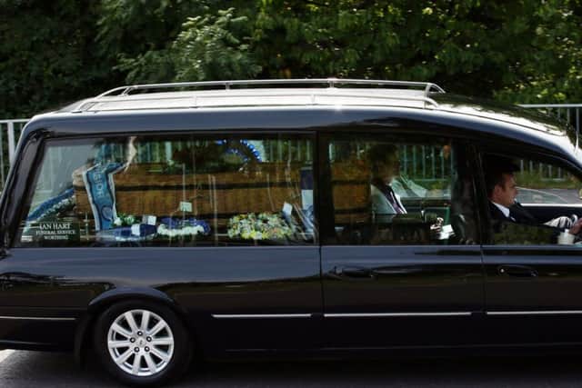 The hearse carrying the coffin of great-grandfather Don Lock makes its way to Worthing Crematorium for his funeral. PRESS ASSOCIATION Photo. Issue date: Wednesday August 12, 2015. Lock, a keen cyclist, was stabbed to death in an alleged road rage attack following a collision involving his car and another vehicle on the A24 at Findon, near Worthing, West Sussex, on July 16. See PA story FUNERAL Lock. Photo credit should read: Yui Mok/PA Wire FUNERAL_Lock_145518.JPG